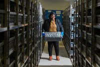 Marie-Noelle Ndjiondjop with packets of rice samples in the AfricaRice genebank in Mbe. Photo: Neil Palmer/Crop Trust