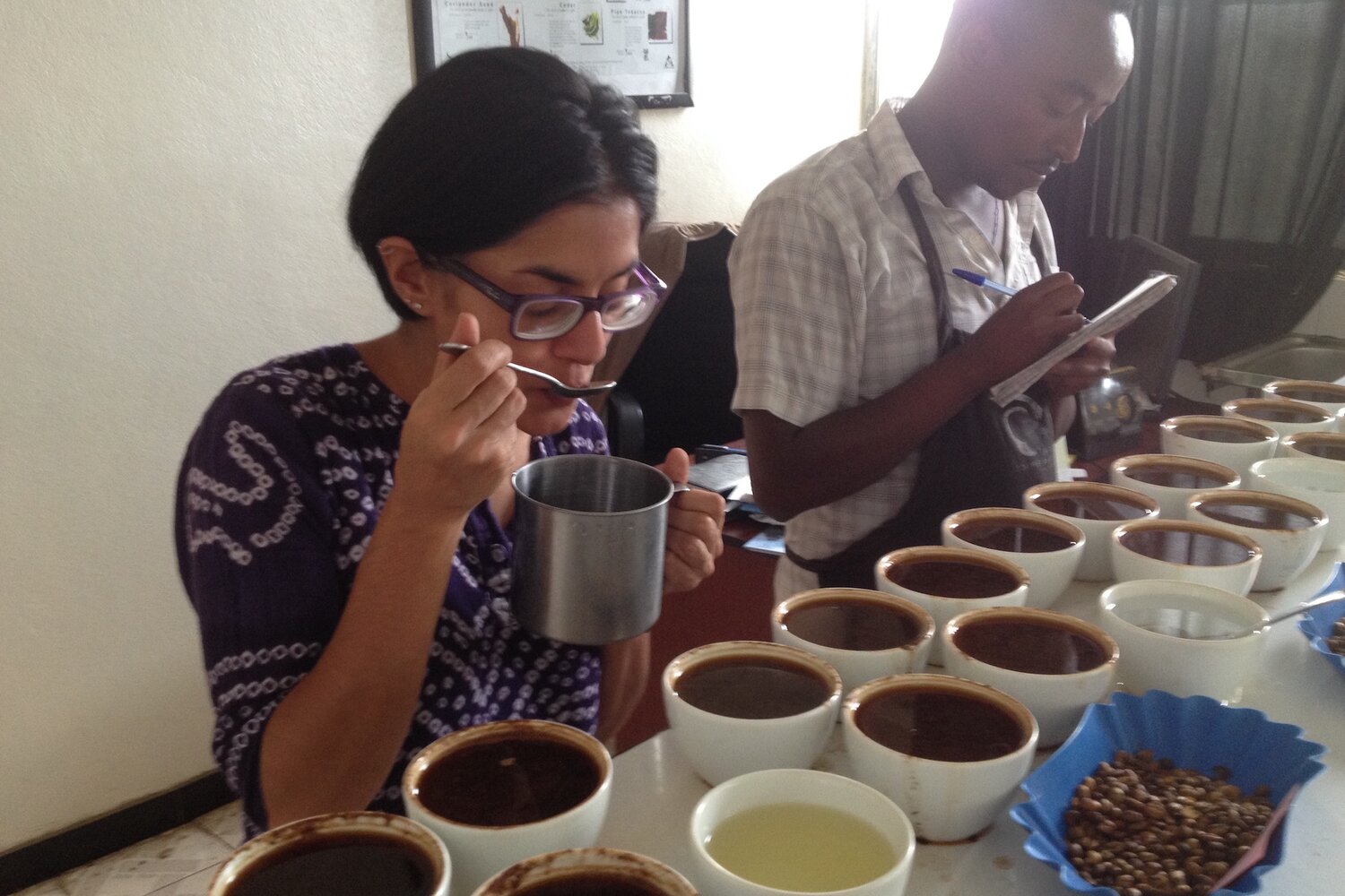 Simran Sethi cupping coffee at the Ethiopian Coffee Exchange in Bonga, Ethiopia. Photo credit: Simran Sethi