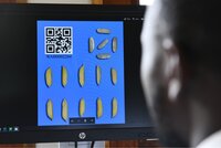Seed samples with QR code on computer screen