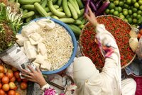 Woman sells different crops at the market
