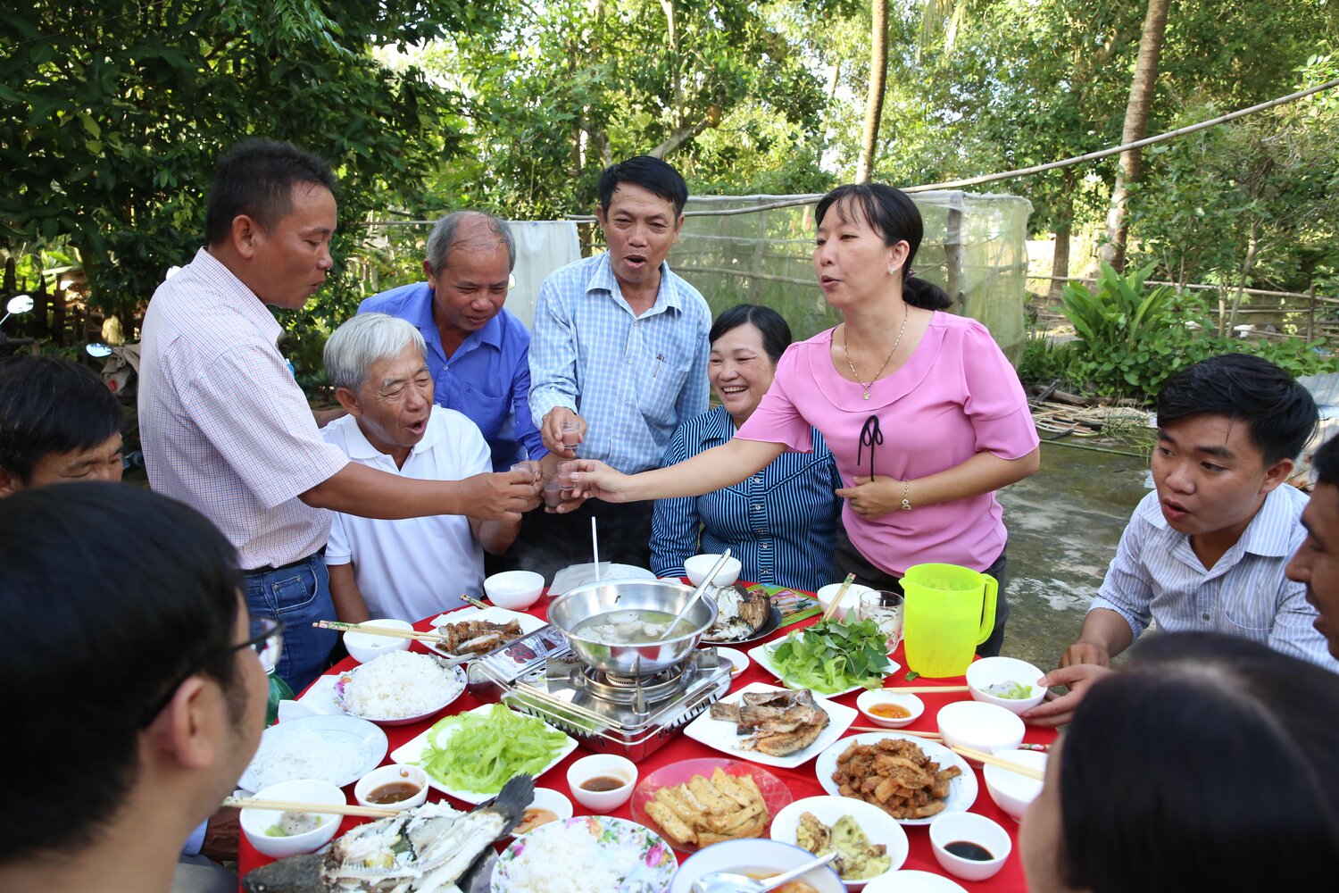 A toast with rice wine! To new friends and collaborators, and to what farmers in the Mekong Delta hope will soon be new rice varieties that have a little wild in them. This scene, shot at the end of our first day in Vietnam, captures a little of the joy and generosity (and delicious food!) of all those who welcomed the Crop Wild Relatives Project guests to the region. Photo: L.M. Salazar