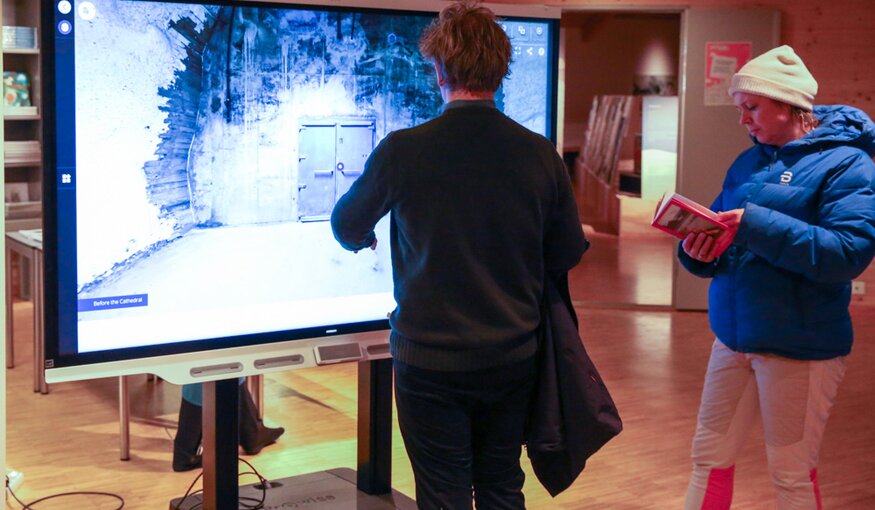 Visitors viewing virtual tour