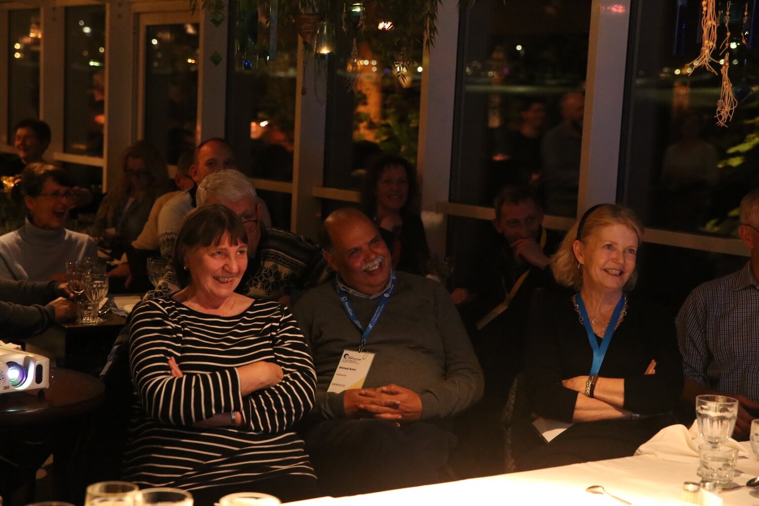 Guests watch the Legacy Award video honouring awardees. 