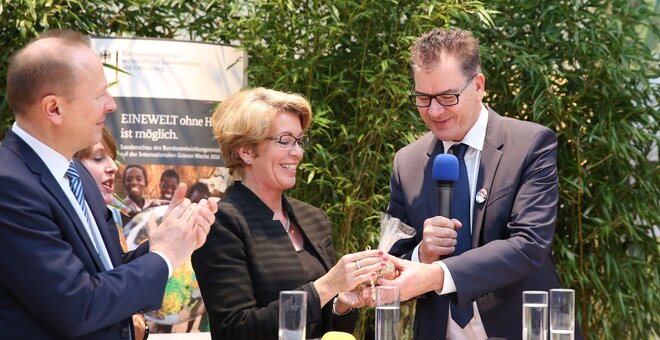 Dr. Gerd Müller,German Minister for Development Cooperation, presents a bag of German wheat to symbolize Germany's latest contribution to the Crop Trust Endowment Fund
