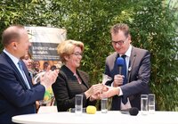 Dr. Gerd Müller,German Minister for Development Cooperation, presents a bag of German wheat to symbolize Germany's latest contribution to the Crop Trust Endowment Fund