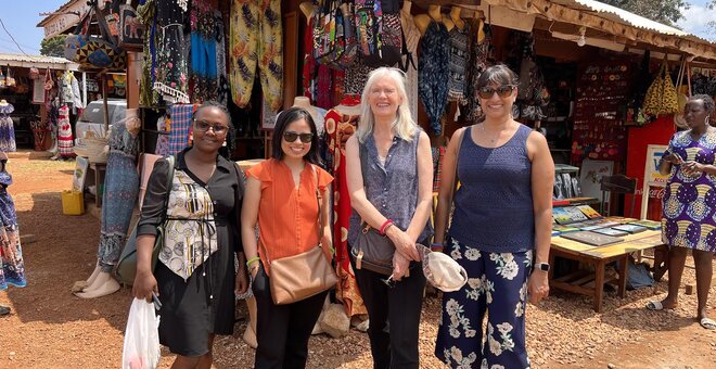 Group standing in front of a market.