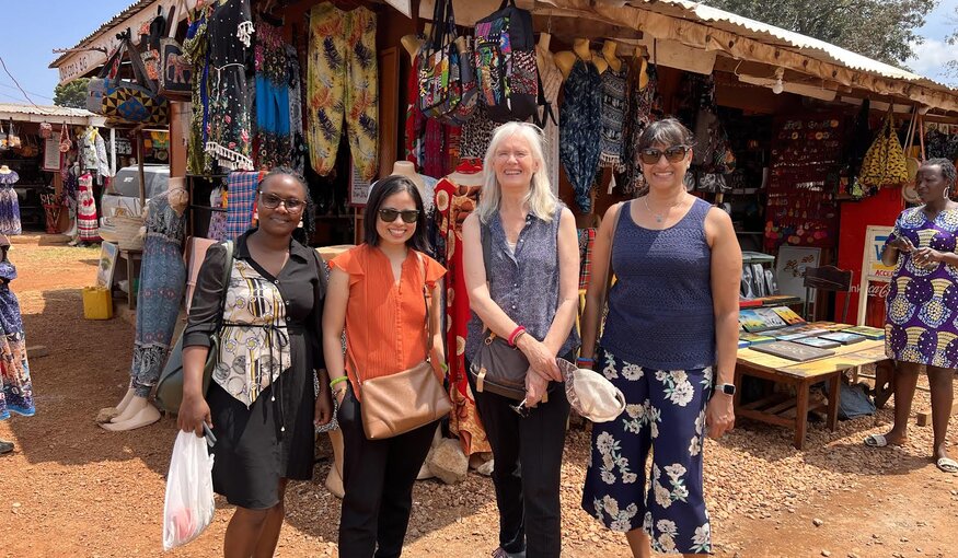 Group standing in front of a market.