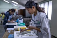 Woman manipulating lab samples