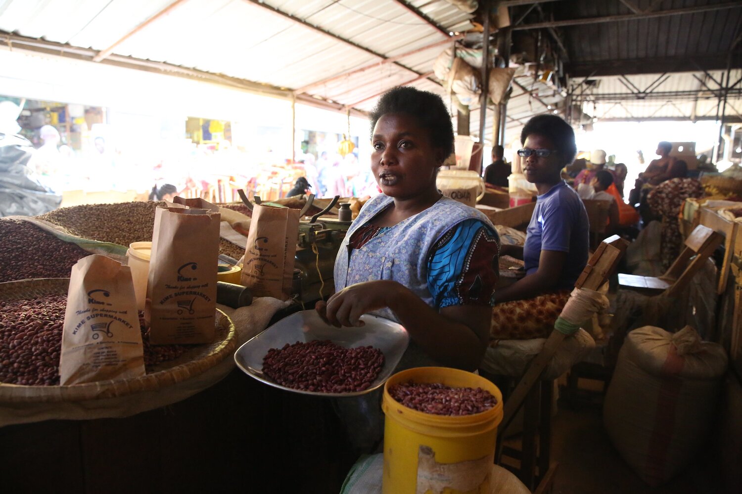 Despite selling wheat, sorghum, millet and groundnuts, the biggest seller at the markets of Kigali is always beans. Julienne Uwishoreye displays a wide selection for every taste, and many of her customers are seeking out the new high-iron varieties. Photo: LM Salazar for #CropsInColor