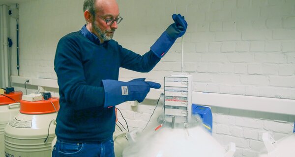 Man displaying cryopreserved samples.