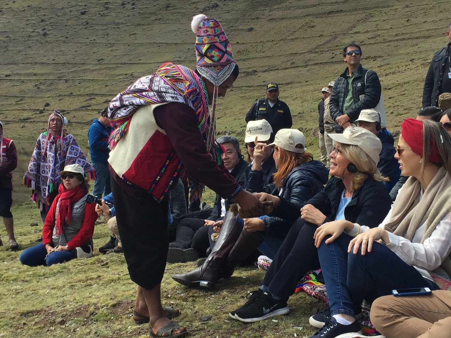 Showcasing wild potato relatives to guests at the Potato Park in Cusco, Peru.