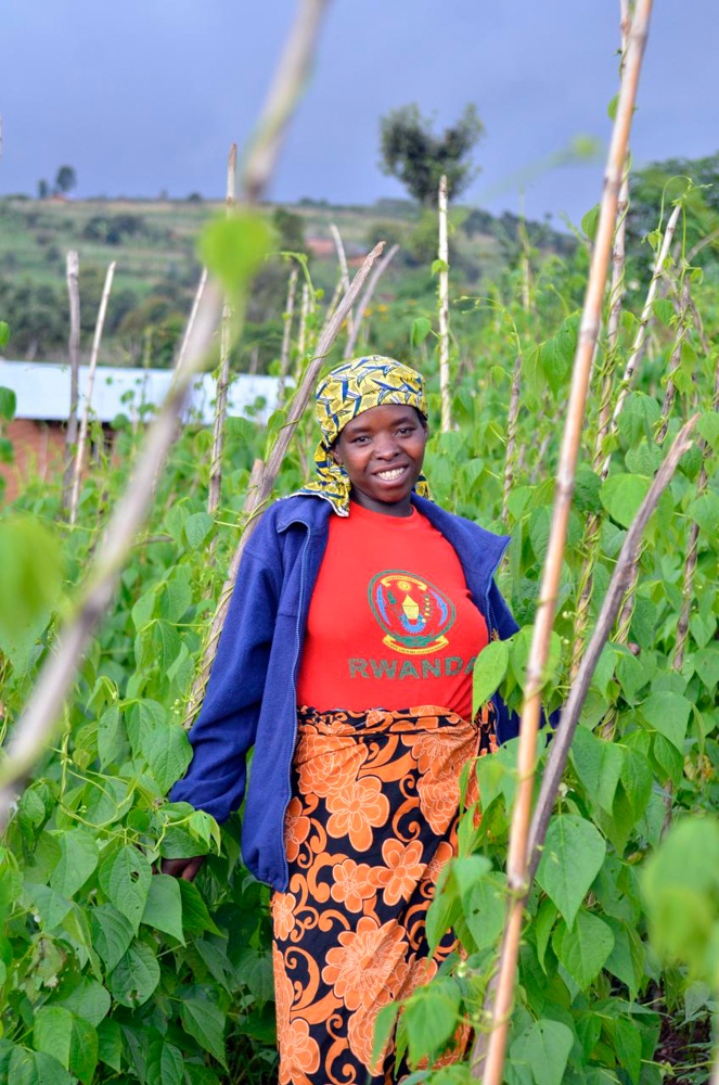 Woman standing in bean field. 