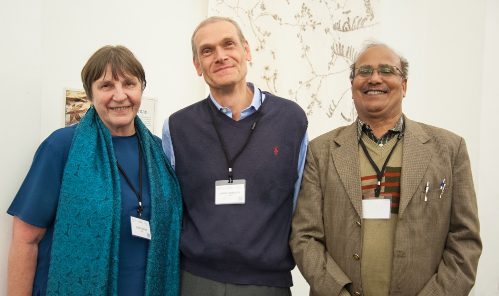 Dr. Debouck standing with Jean Hanson and Hari Upadhyaya 