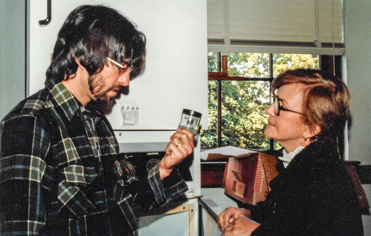 David Ellis showing his mother his PhD. 