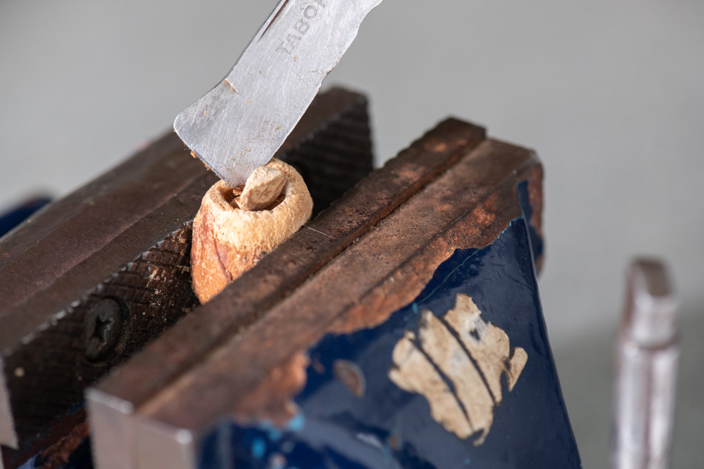 Extraction of Melia volkensii seed on a custom-made vice. Photo: Michael Major/Crop Trust