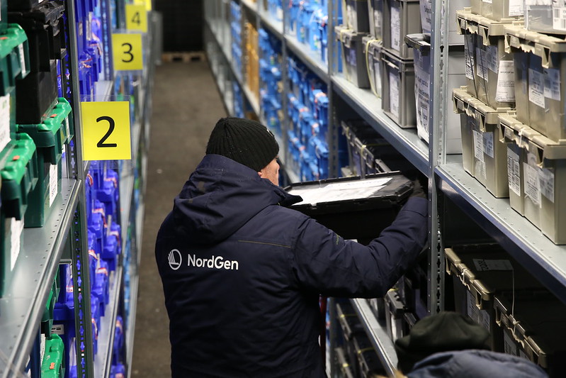 Person shelving container inside Svalbard Global Seed Vault
