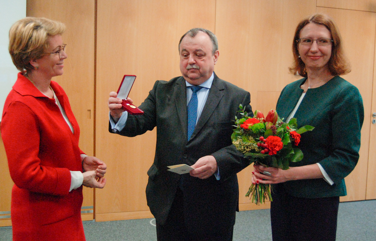 Crop Trust's Executive Director Marie Haga is presented the N.I. Vavilov Medal by Sergey Aleksandrovich Smirnov, Vice-consul of the Consulate General of Russian Federation in Bonn and Elena Popova, Crop Trust.